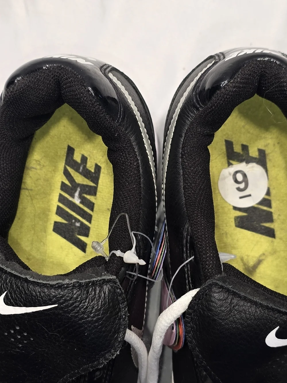 Nike Black and White Baseball Cleats with Colored Heel Tabs